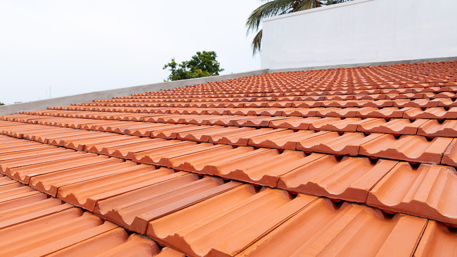 Extruded interlocking terracotta roof tiles